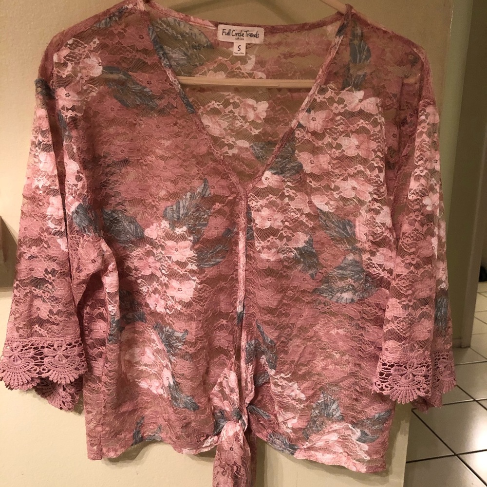 Beautiful lace, see through blouse with tie bottom